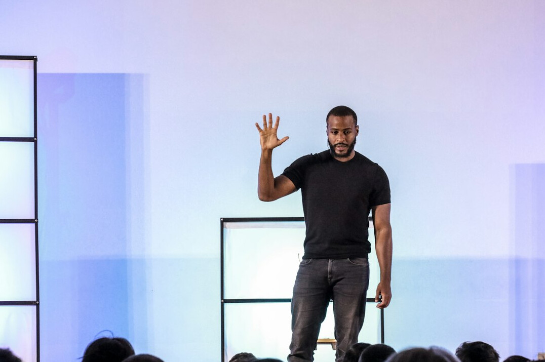 leader on stage presenting
