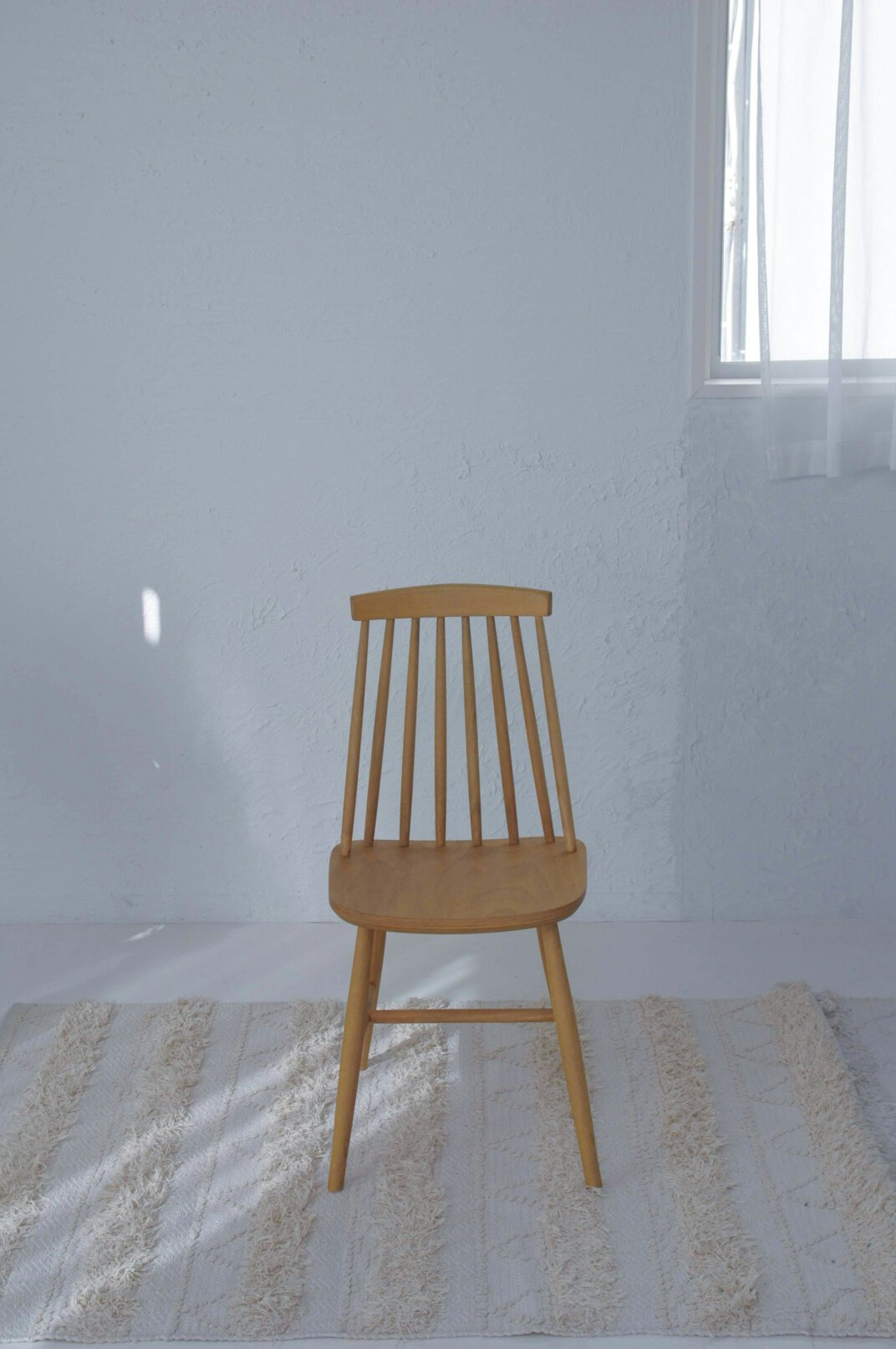 Quiet minimalist studio room with soft daylight