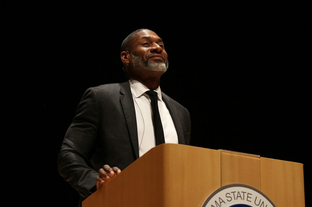 executive speaking on stage